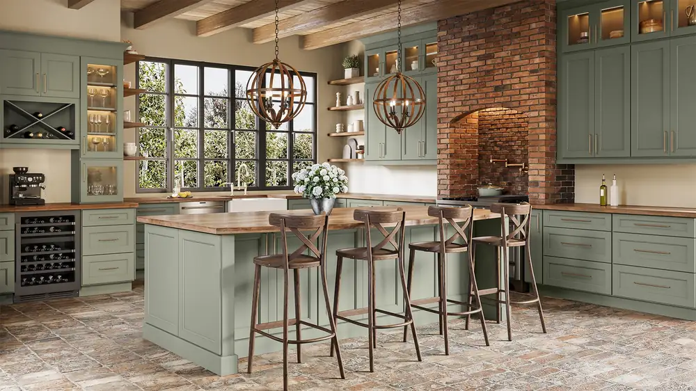 Sage green kitchen with a wood-topped island and brick accent wall